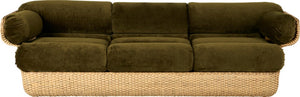 Green sofa with wicker base on a white background